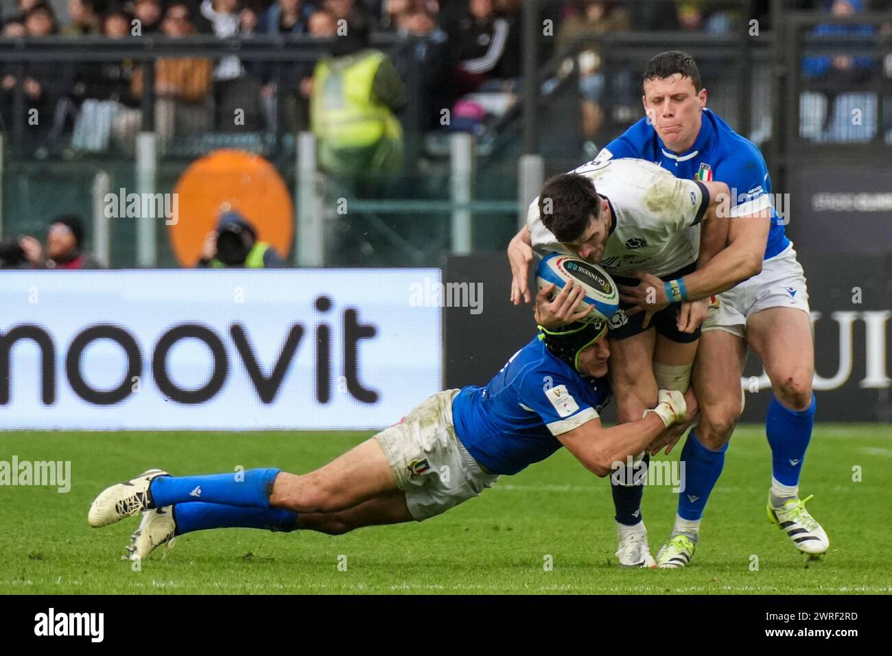 Blair Kinghorn of Scotland is tackled by Juan Ignacio Brex of Italy during the Guinness Six Nations 2024 rugby union international match between Italy and Scotland at the Olympic Stadium. Final score: Italy 31 - 29 Scotland. Stock Photo