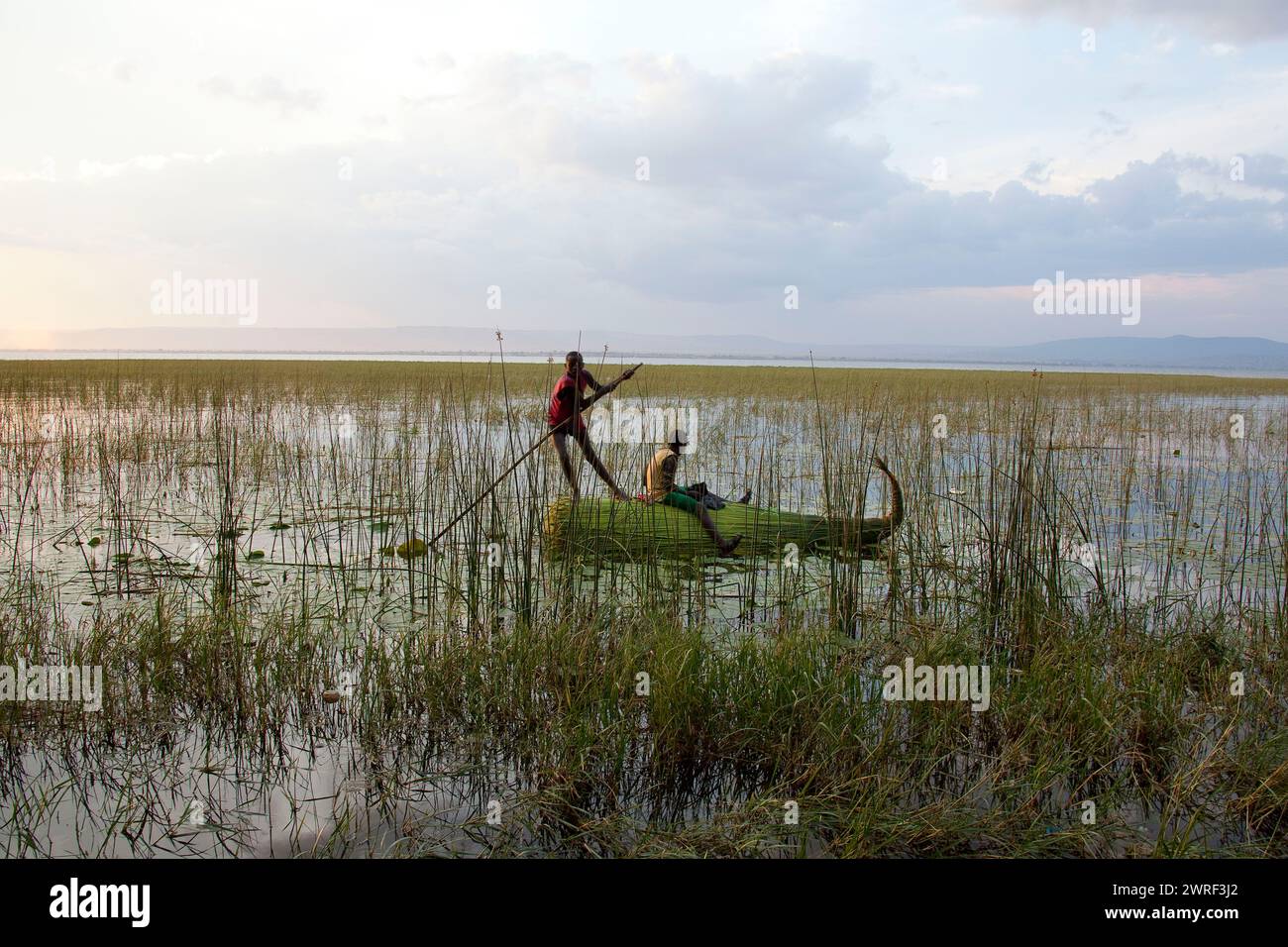 African Reed Boats AWASSA, ETHIOPIA - NOVEMBER 27, 2011: Unidentified teenagers go on the ...