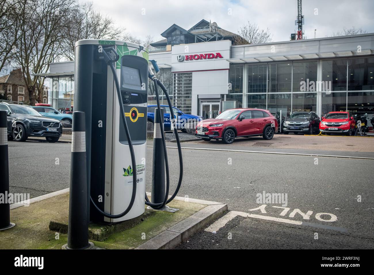 LONDON- FEBRUARY 5, 2024:Electric charging station outside Honda car dealer in Chiswick, west London Stock Photo