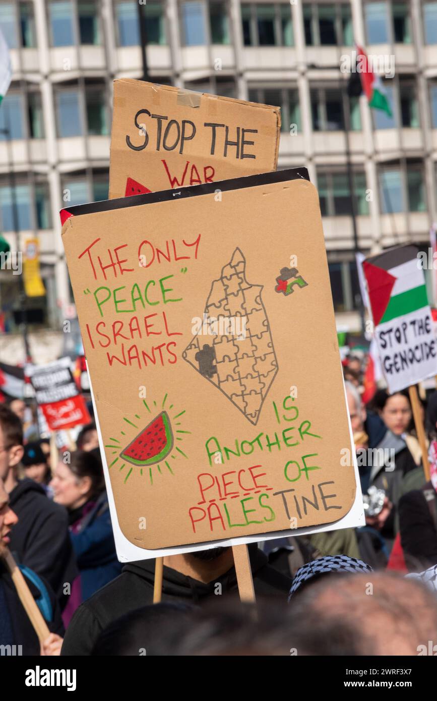 Pro Palestine protest march in London, UK, protesting against the conflict in Gaza and against Israel occupation. Occupation of Palestine placard Stock Photo