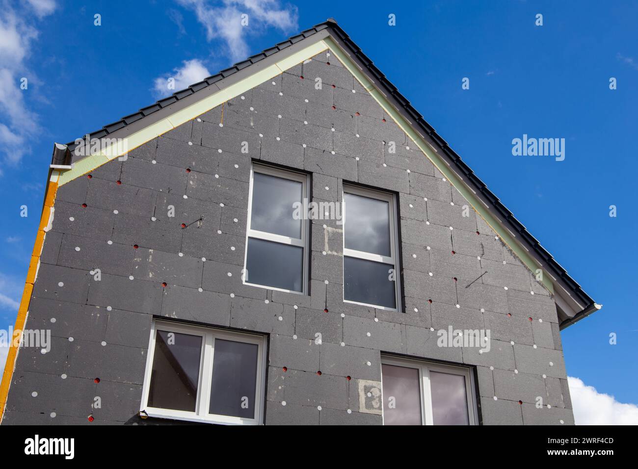 Thermal insulation of a house facade on a detached house Stock Photo ...