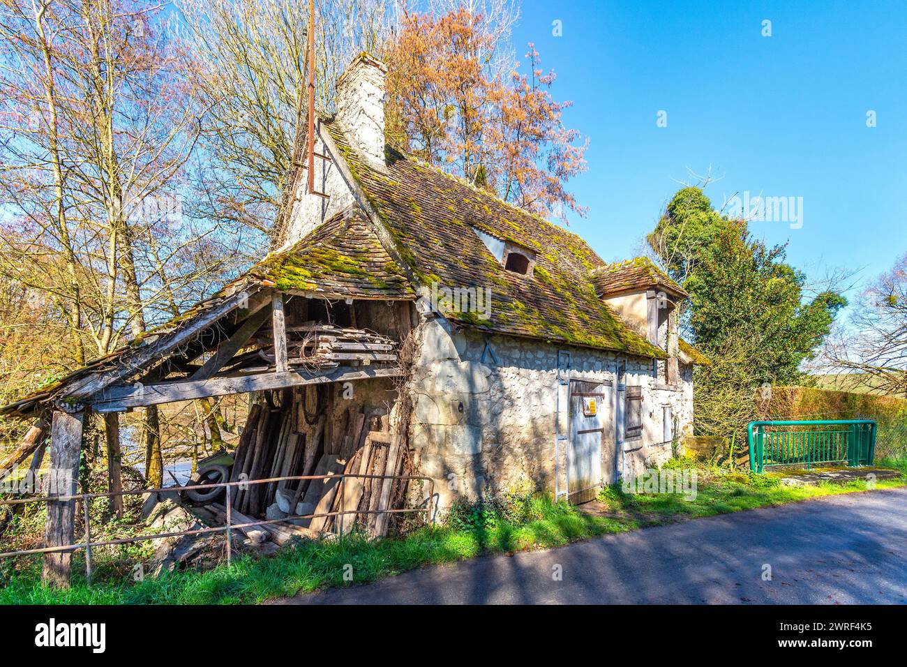 Semi-derelict rural roadside property typical for renovation project - central France. Stock Photo