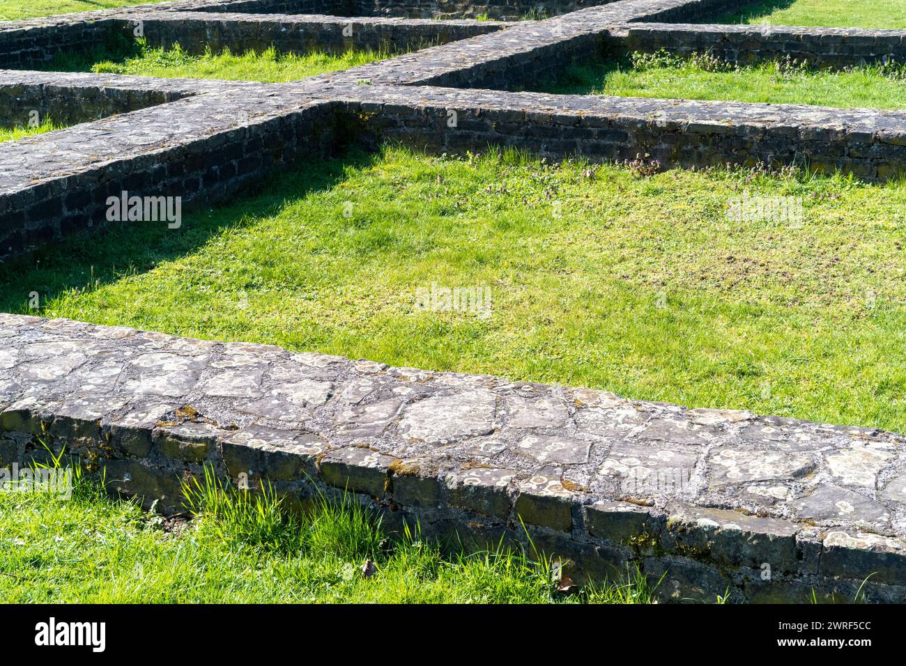 stone foundation on the meadow Stock Photo - Alamy