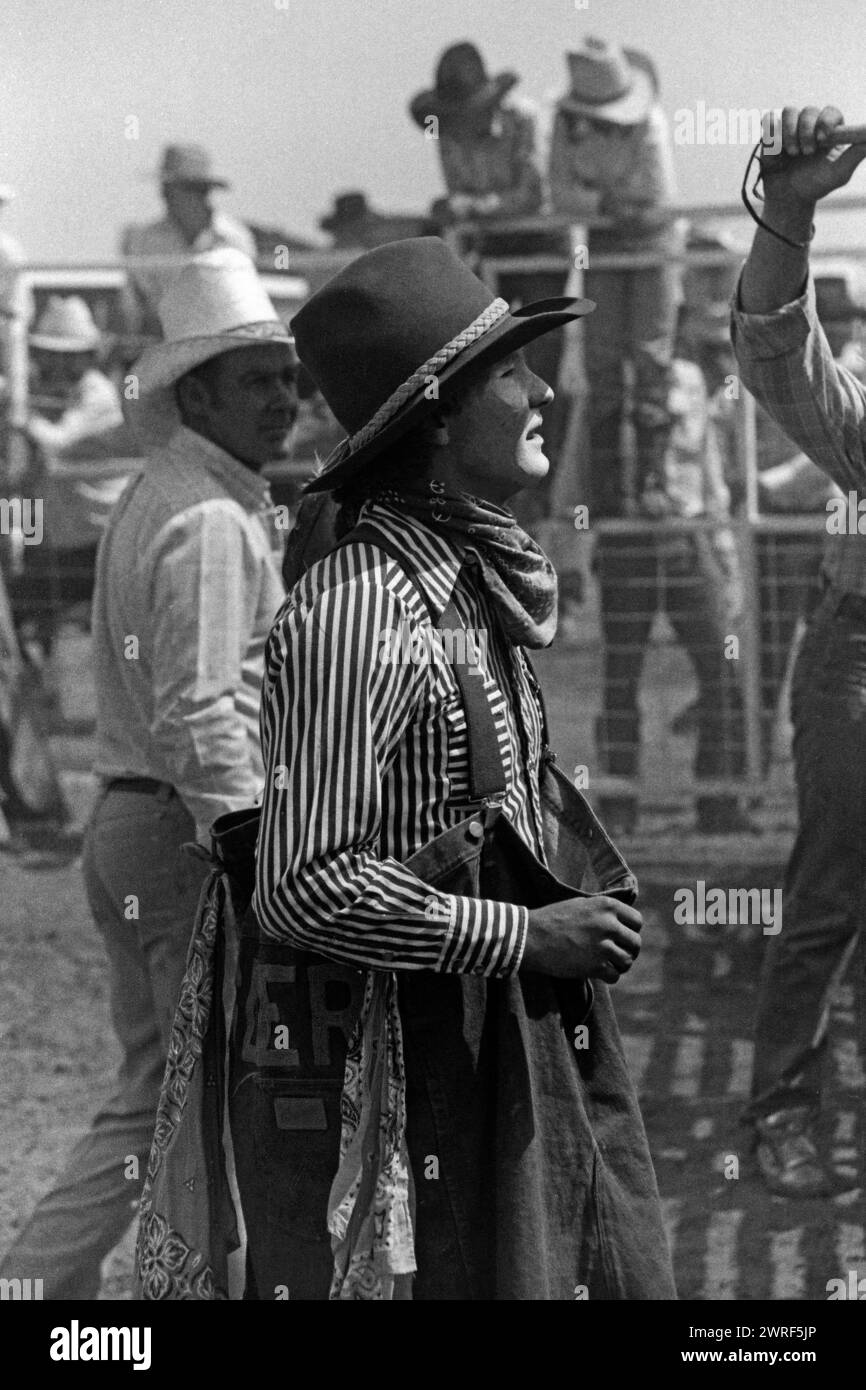 Vintage photo of a rodeo clown standing next to a rodeo flag judge at the Rockyford Rodeo. Alberta Canada. Circa 1981 Stock Photo