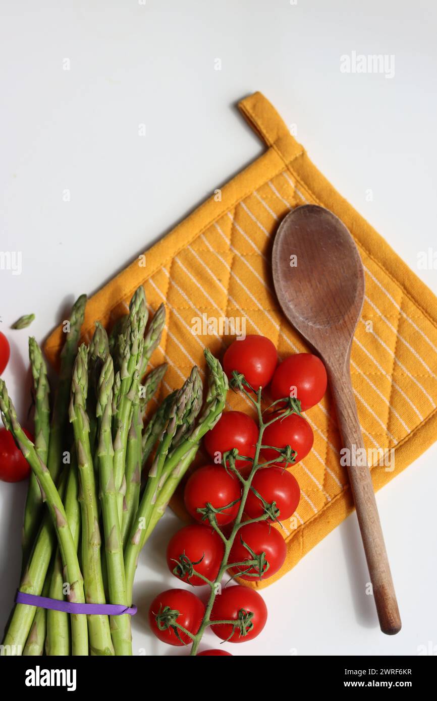 Bunch of fresh green asparagus close up  photo. Raw asparagus top view. Healthy eating concept. Natural vitamins and antioxidants. Stock Photo