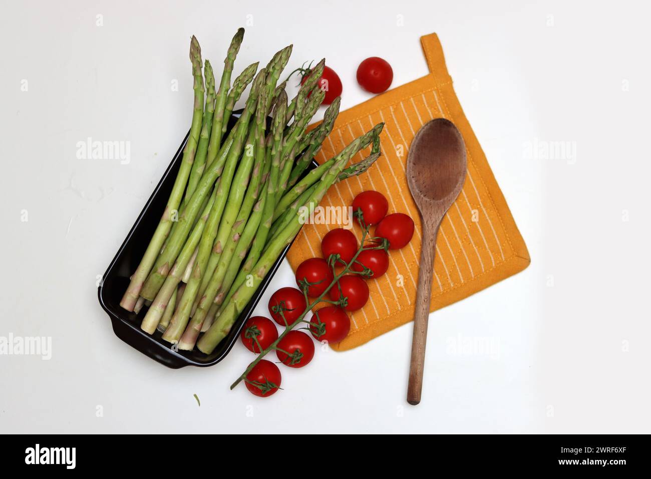 Bunch of fresh green asparagus close up  photo. Raw asparagus top view. Healthy eating concept. Natural vitamins and antioxidants. Stock Photo