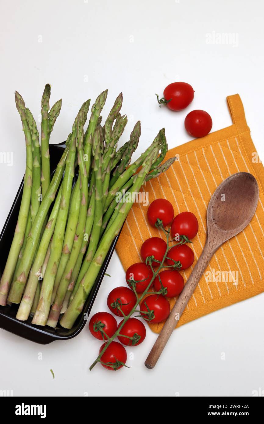 Bunch of fresh green asparagus close up  photo. Raw asparagus top view. Healthy eating concept. Natural vitamins and antioxidants. Stock Photo