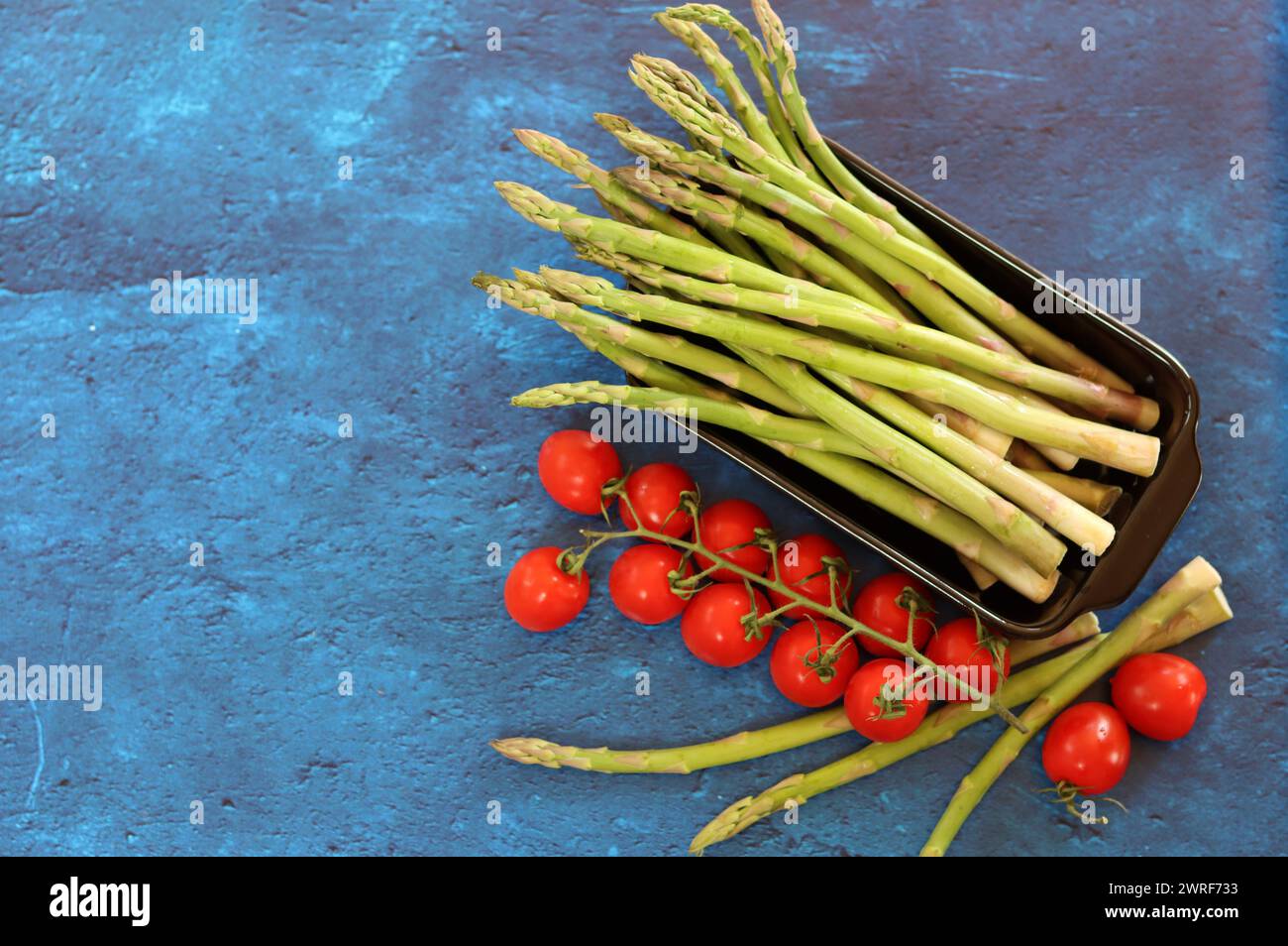 Bunch of fresh green asparagus close up  photo. Raw asparagus top view. Healthy eating concept. Natural vitamins and antioxidants. Stock Photo
