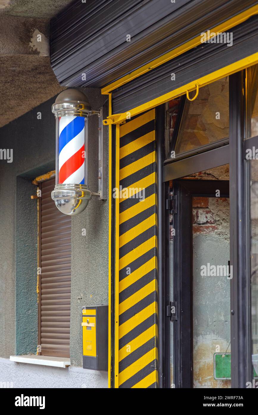 Traditional Barber Pole Sign at Hairdresser Salon Building Stock Photo ...