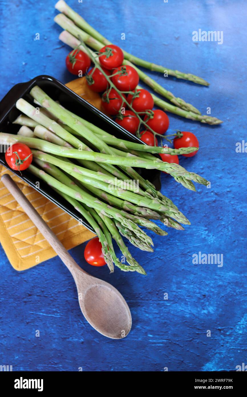 Bunch of fresh green asparagus close up  photo. Raw asparagus top view. Healthy eating concept. Natural vitamins and antioxidants. Stock Photo