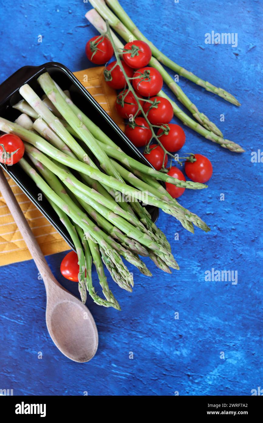 Bunch of fresh green asparagus close up  photo. Raw asparagus top view. Healthy eating concept. Natural vitamins and antioxidants. Stock Photo