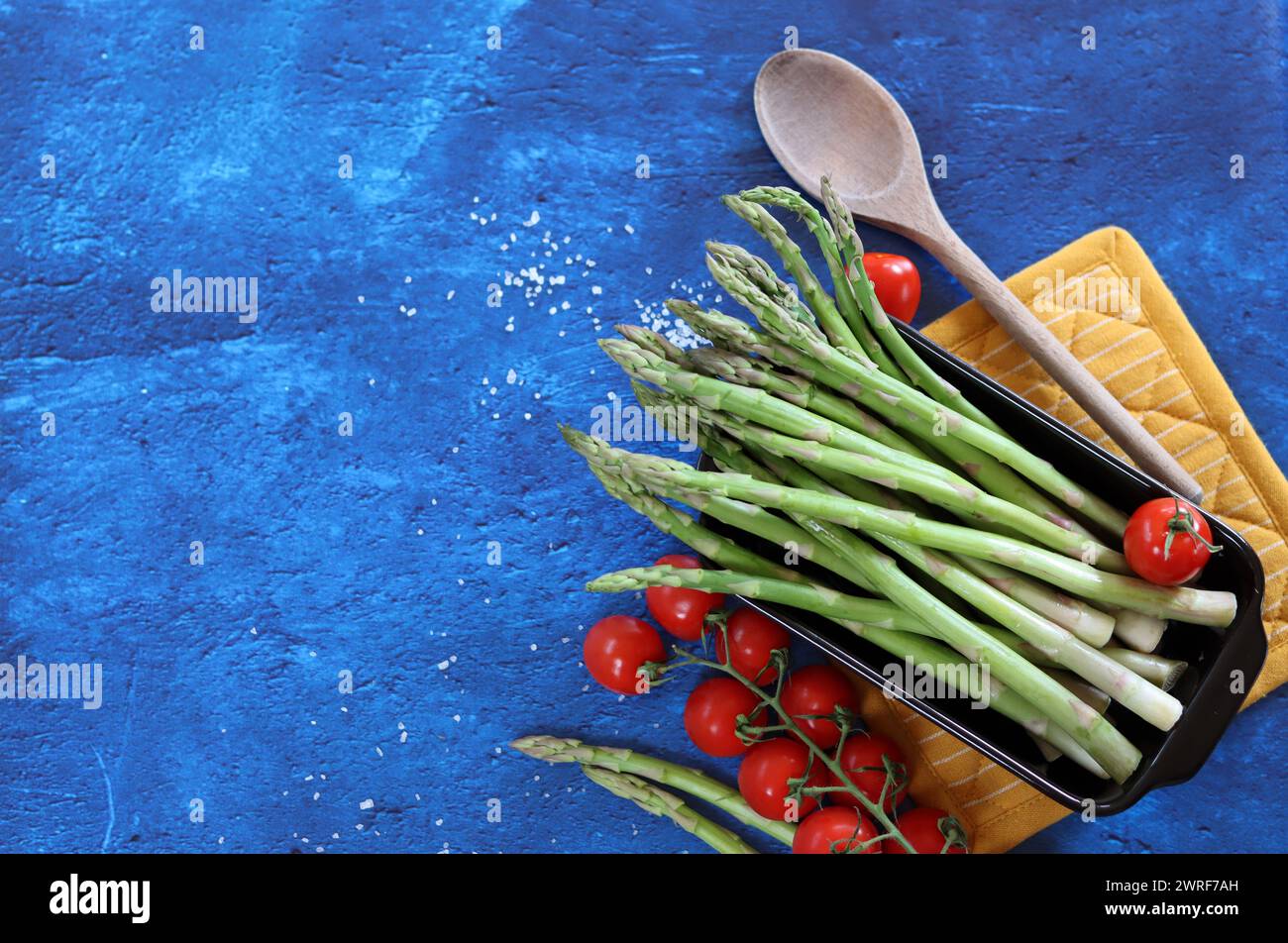 Bunch of fresh green asparagus close up  photo. Raw asparagus top view. Healthy eating concept. Natural vitamins and antioxidants. Stock Photo