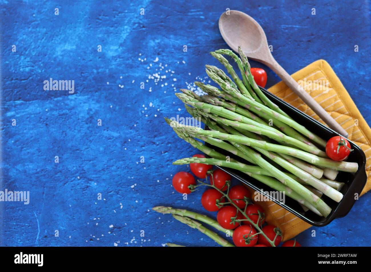 Bunch of fresh green asparagus close up  photo. Raw asparagus top view. Healthy eating concept. Natural vitamins and antioxidants. Stock Photo