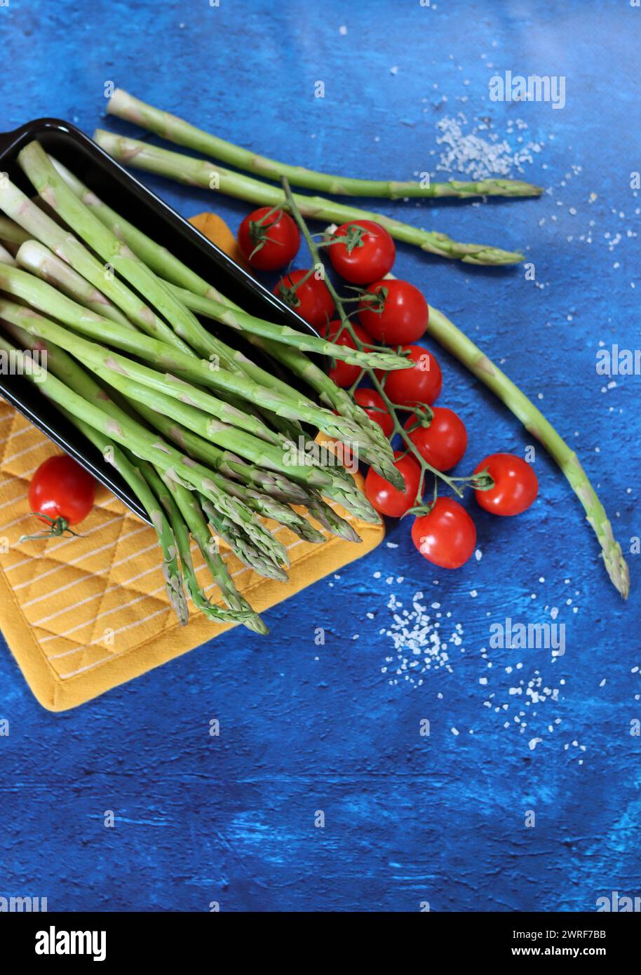 Bunch of fresh green asparagus close up  photo. Raw asparagus top view. Healthy eating concept. Natural vitamins and antioxidants. Stock Photo