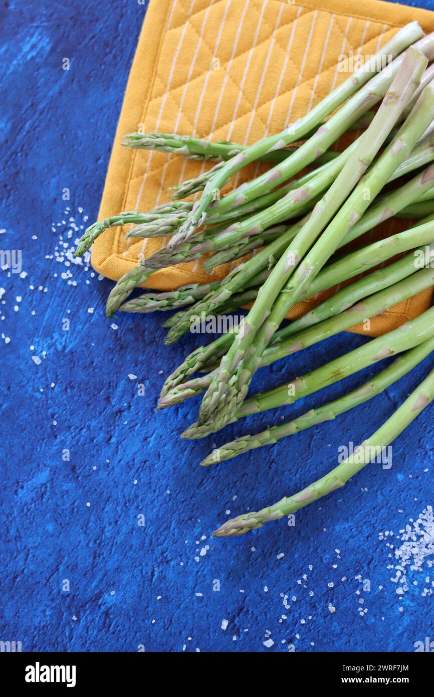 Bunch of fresh green asparagus close up  photo. Raw asparagus top view. Healthy eating concept. Natural vitamins and antioxidants. Stock Photo