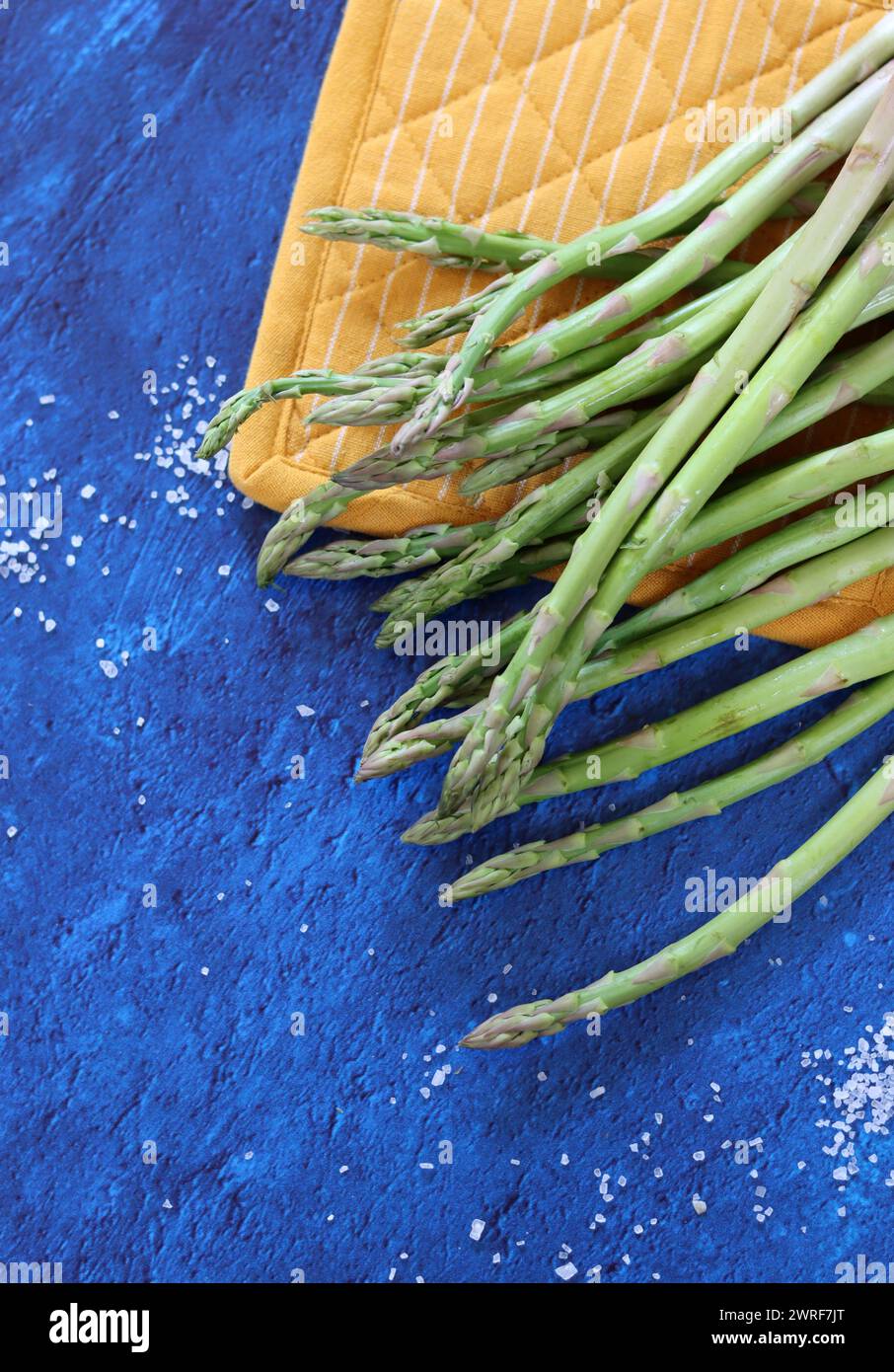 Bunch of fresh green asparagus close up  photo. Raw asparagus top view. Healthy eating concept. Natural vitamins and antioxidants. Stock Photo