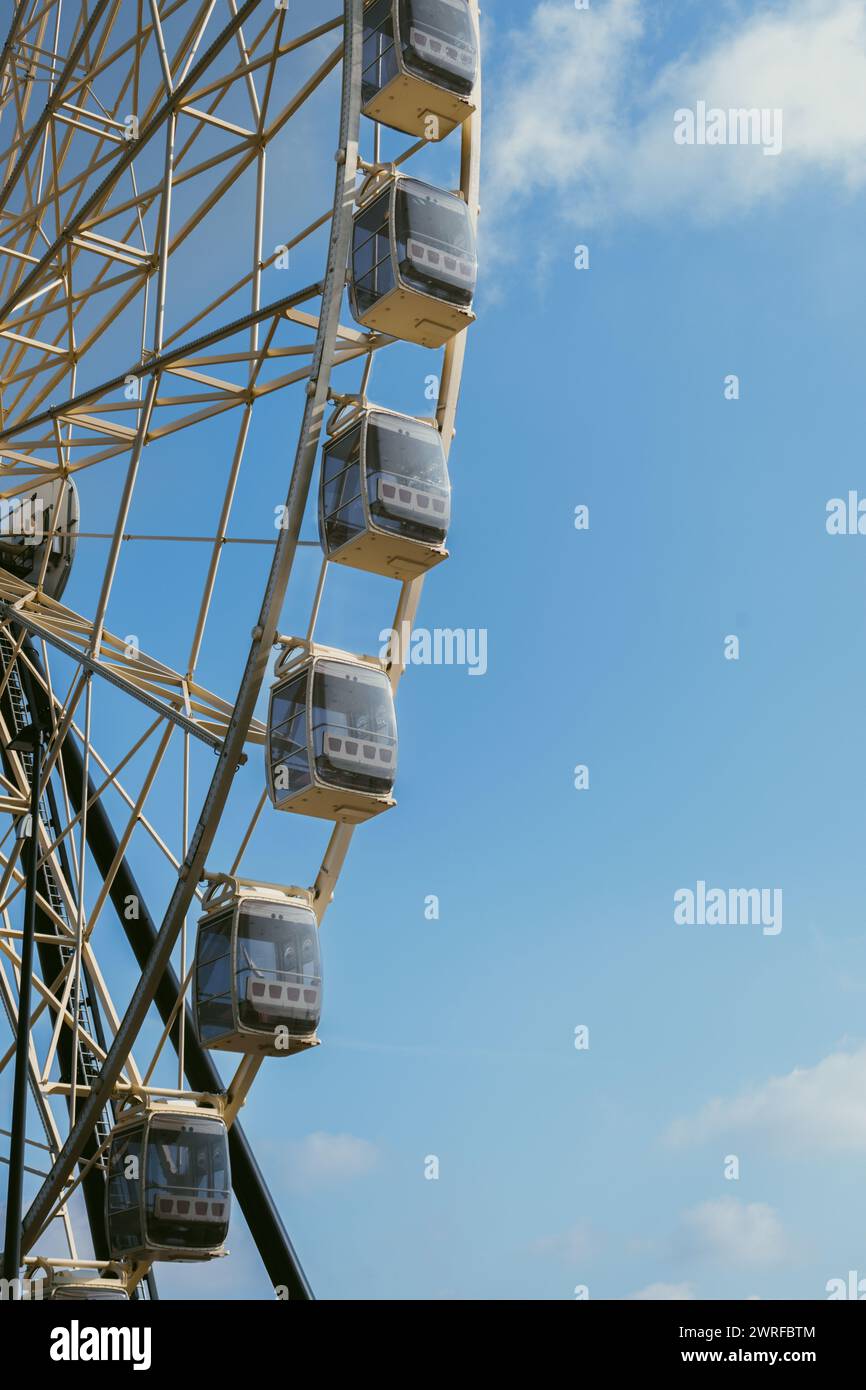 Ferris wheel against blue sky with clouds Stock Photo - Alamy