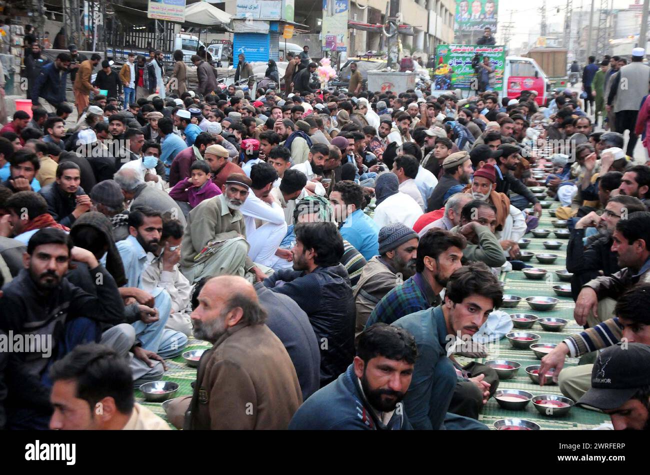 Faithful Muslims are breaking the fast (Iftar) during the Holy month of Ramadan-ul-Mubarak, at Raja Bazar in Rawalpindi on Tuesday, March 12, 2024. Credit: Pakistan Press International (PPI)/Alamy Live News Stock Photo