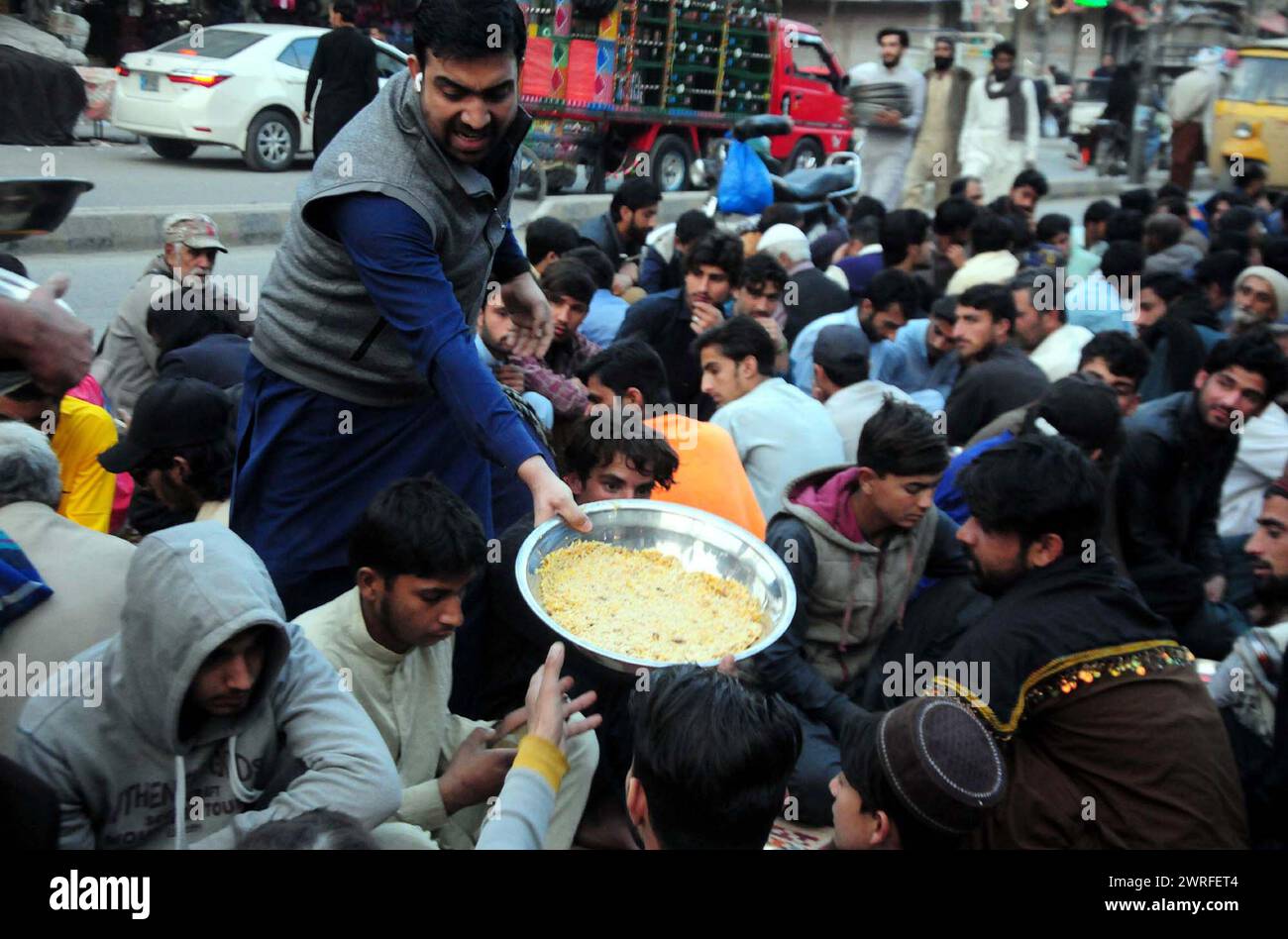 Faithful Muslims are breaking the fast (Iftar) during the Holy month of Ramadan-ul-Mubarak, at Raja Bazar in Rawalpindi on Tuesday, March 12, 2024. Credit: Pakistan Press International (PPI)/Alamy Live News Stock Photo