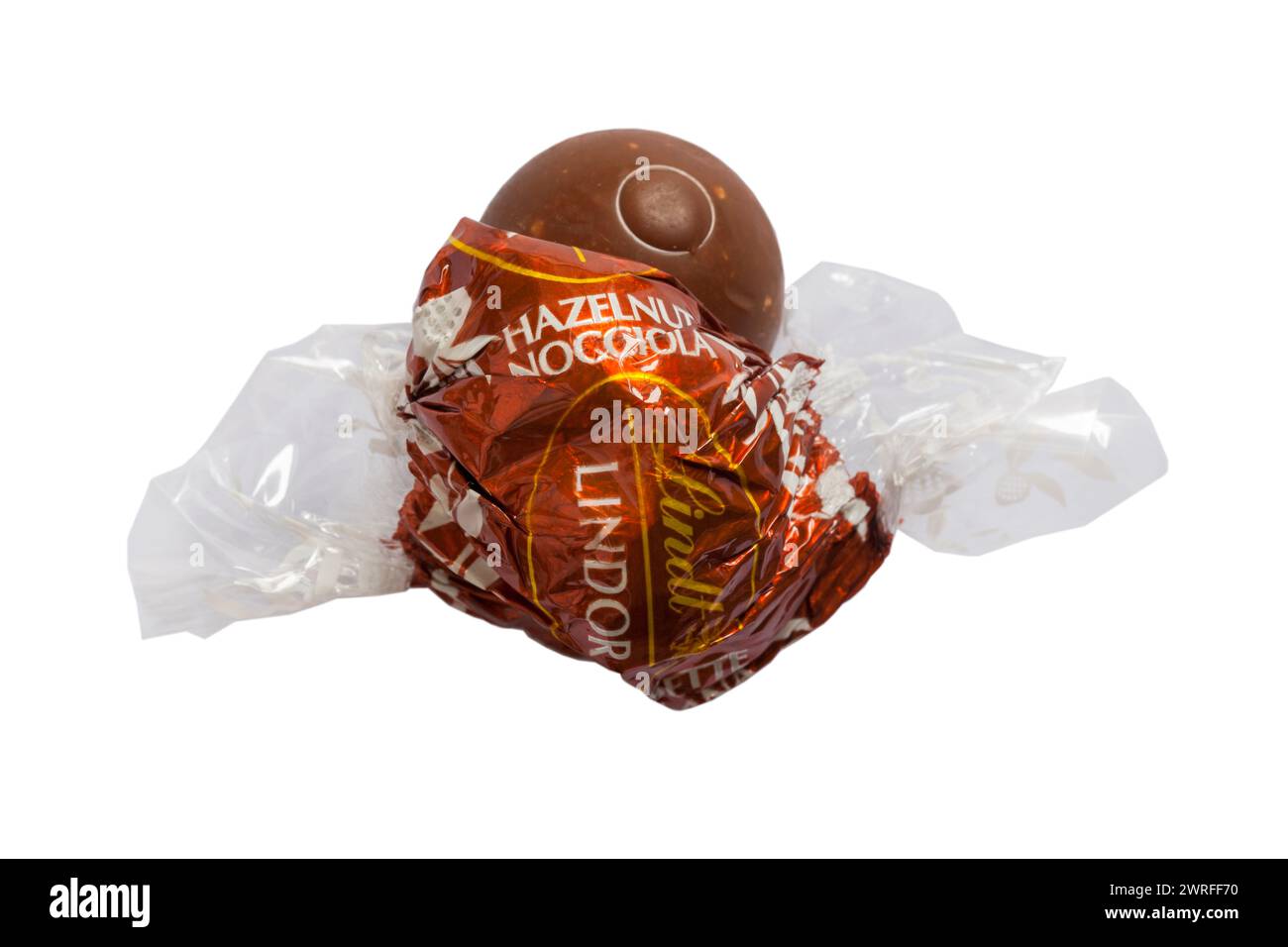 Lindt Lindor hazelnut chocolate opened to show contents isolated on white background Stock Photo