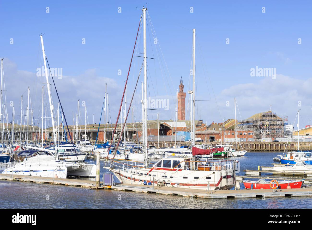 Grimsby docks Grimsby Dock tower behind the yachts in the Humber Cruising Association marina old Fish Dock No1 Grimsby North Lincolnshire England UK Stock Photo