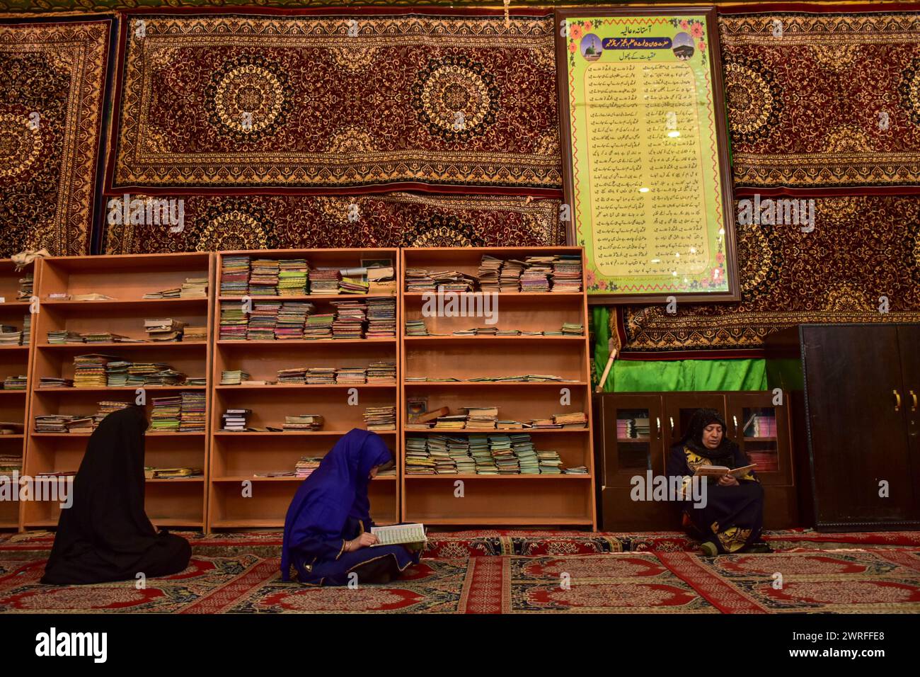 Kashmiri Muslim women recite the Holy Quran inside the shrine of Syed ...
