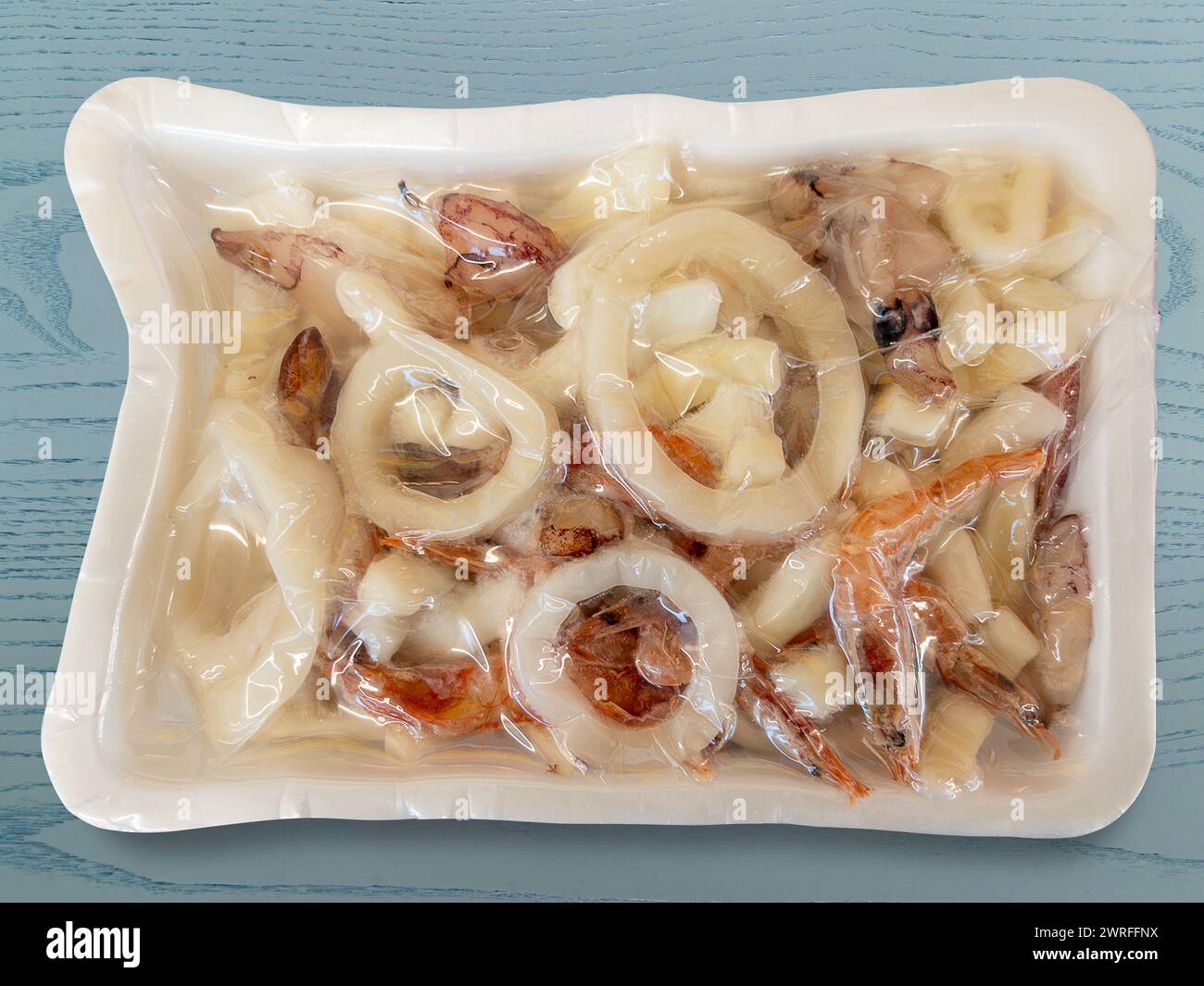 Chopped and frozen squid and shrimp and cuttlefish in vacuumsealed