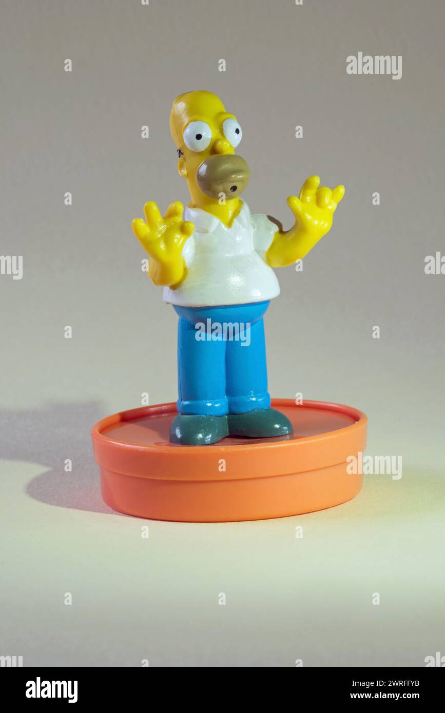 Plastic Homer Simpson figure on orange base Stock Photo