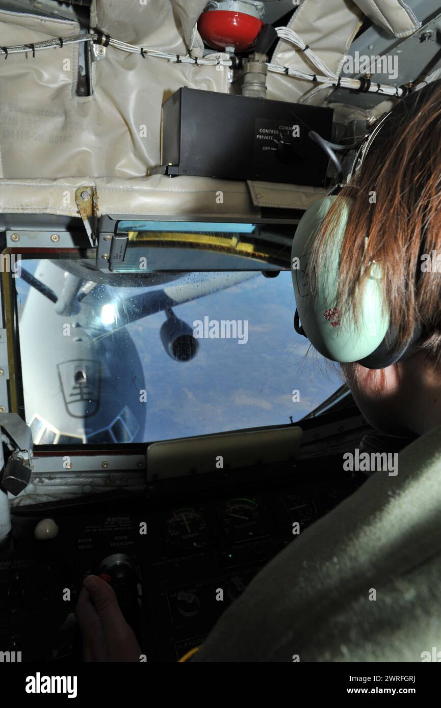 Airman 1st Class Katherine Dickey, 93rd Air Refueling Squadron boom operator, controls the boom to refuel a KC-10 Extender from Travis Air Force Base Stock Photo