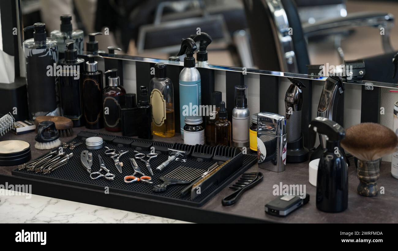 Men's hair and beard care products. Barbers tools for mens haircuts laid out on a table. Stock Photo