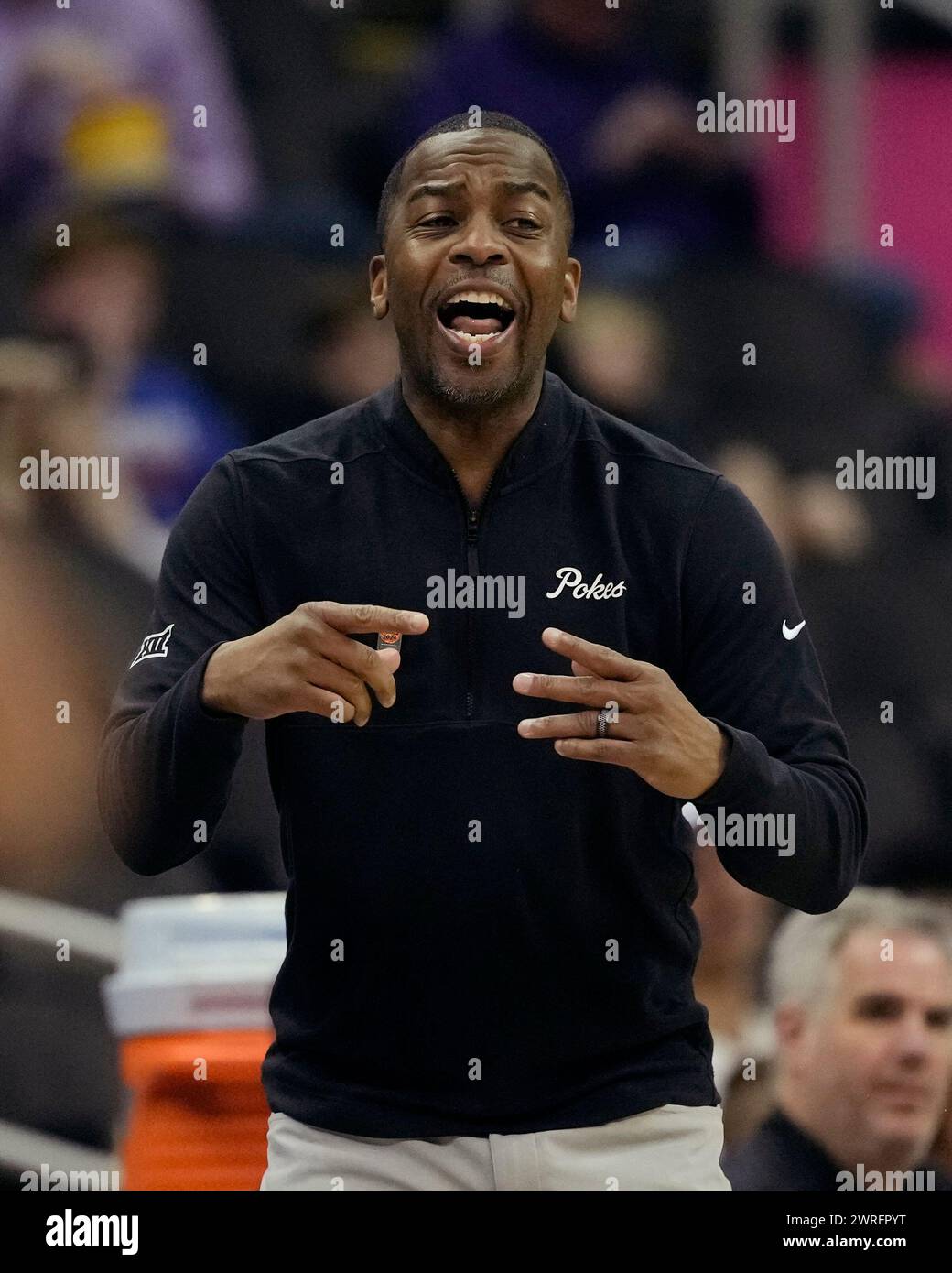 Oklahoma State head coach Mike Boynton, Jr. talks to his players during