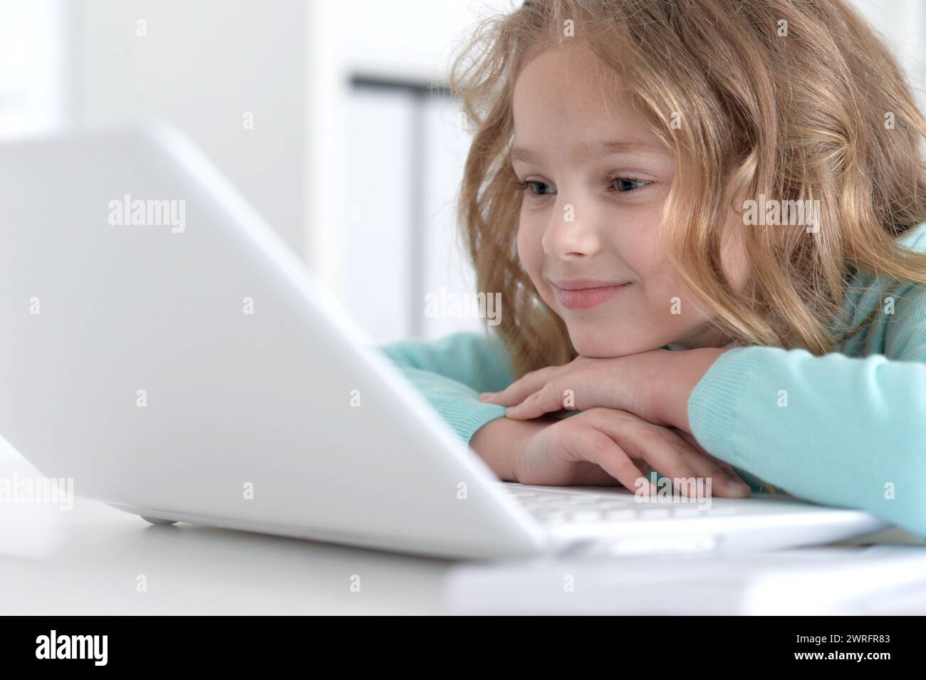 Cute and happy little girl children using laptop computer Stock Photo ...