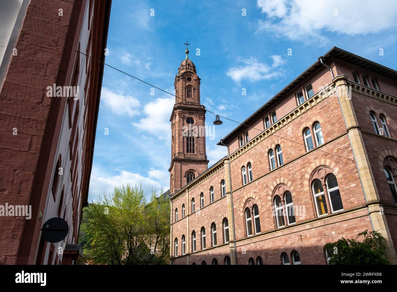 Jesuit Catholic Church Belfry in Heidelberg, Baden-Wurttemberg Germany. Under view of Jesuitenkirche brick wall ancient church. Stock Photo