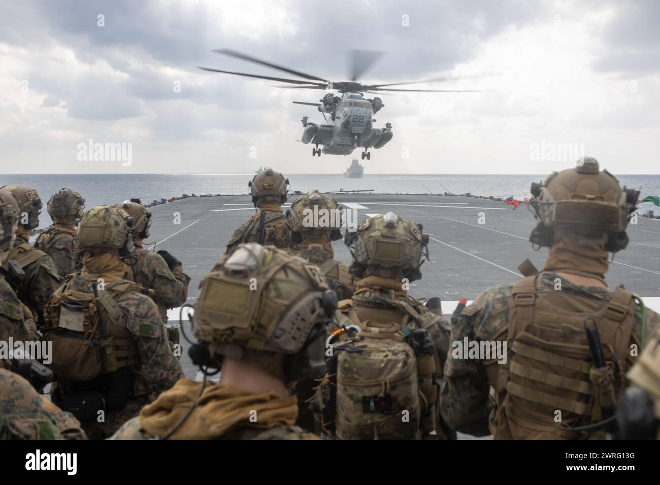 U.S. Marines with the maritime raid force, 31st Marine Expeditionary Unit, prepare to board a CH-53E Super Stallion during a visit, board, and search Stock Photo