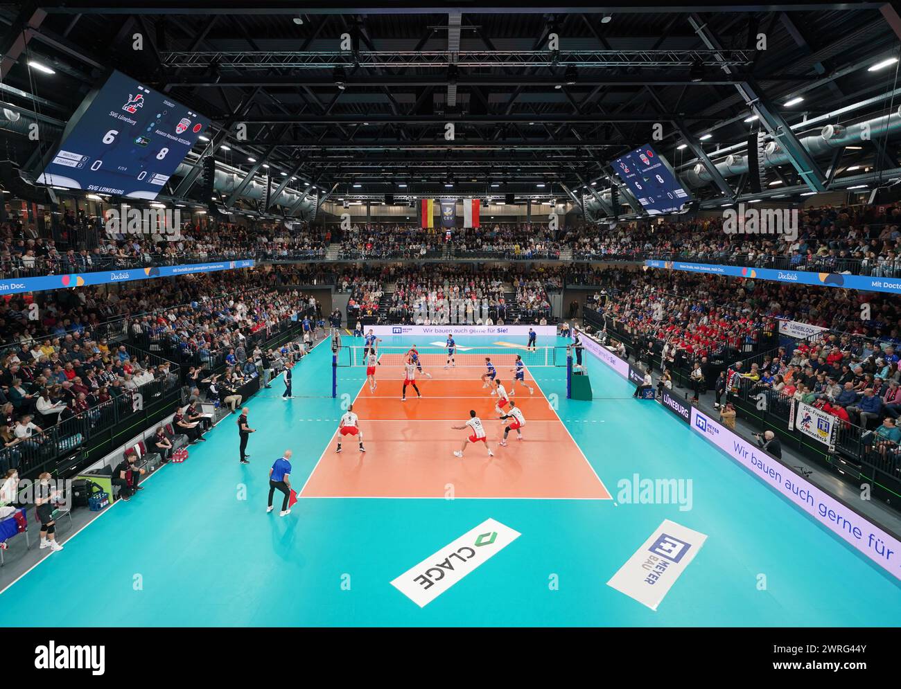 12 March 2024, Lower Saxony, Lüneburg: Volleyball, men: CEV Cup, SVG Lüneburg - Resovia Rzeszow, final, first leg, in the LKH Arena. Both teams in action. Photo: Marcus Brandt/dpa Stock Photo
