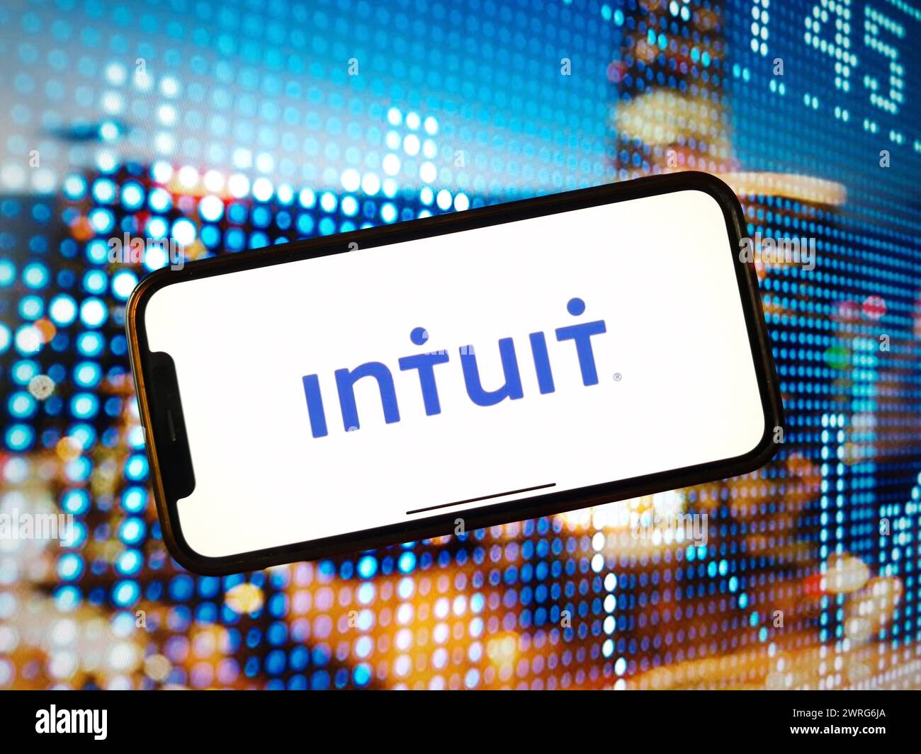 In this photo illustration, the Intuit company logo is seen displayed on a smartphone screen. Stock Photo