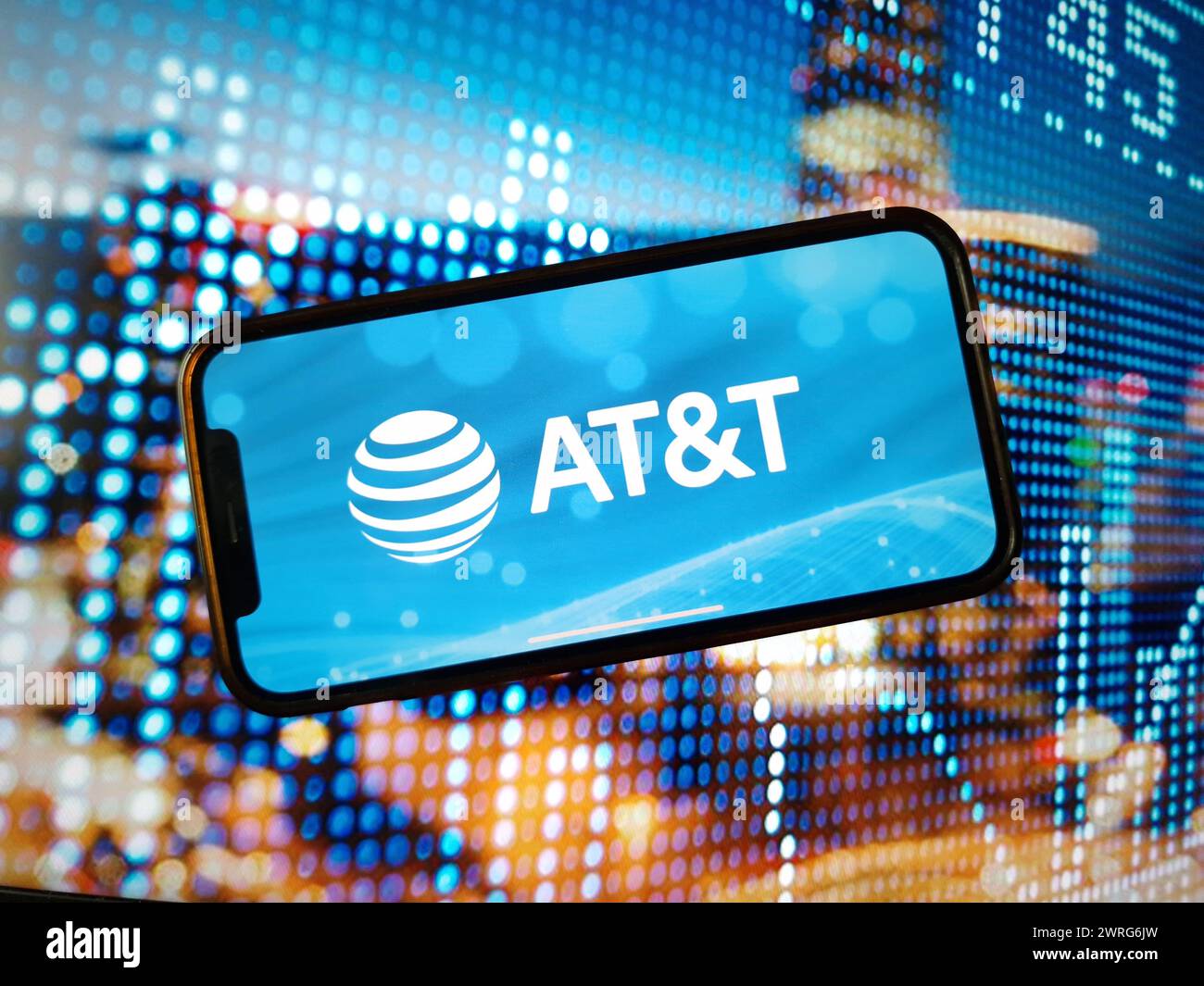 In this photo illustration the AT T company logo is seen displayed on