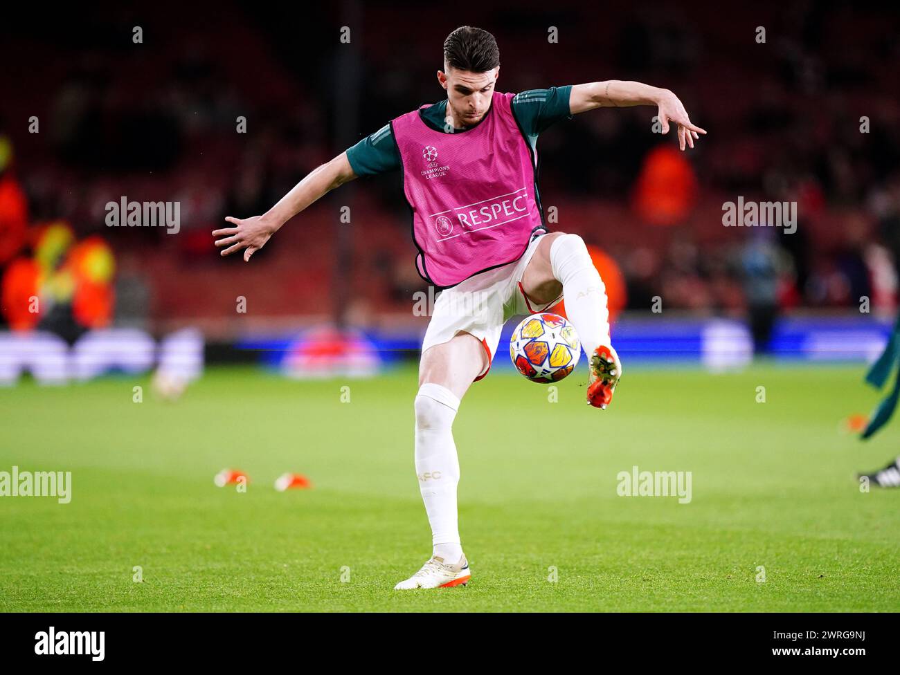 Arsenal's Declan Rice warms up ahead of the UEFA Champions League Round of 16, second leg match at the Emirates Stadium, London. Picture date: Tuesday March 12, 2024. Stock Photo