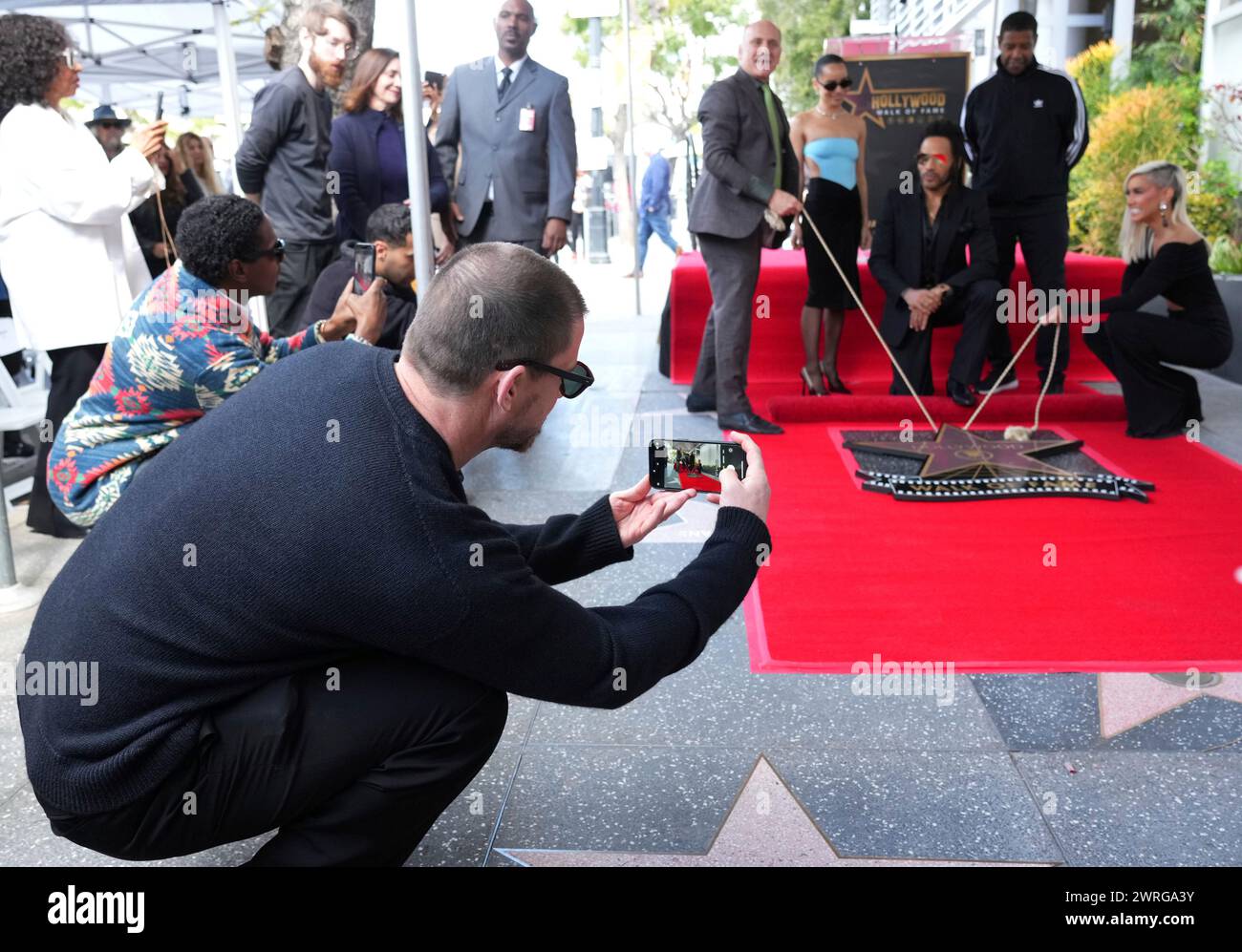 Channing Tatum, far left, takes a picture of Zoe Kravitz, from left