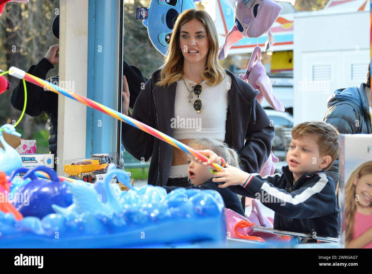 Milan, . 12th Mar, 2024. Claudio Mangiarotti rights copyright Milan - Chiara Ferragni's single life after returning from the United States, she spends the afternoon in the gardens of Parco Sempione with her children Leone and Vittoria, her mother Marina di Guardo. The opportunity to also celebrate the birthday of sister Francesca Ferragni and son Riccardo. Note the sculpted abs of Chiara Ferragni Ph Claudio Mangiarotti Credit: Independent Photo Agency/Alamy Live News Stock Photo