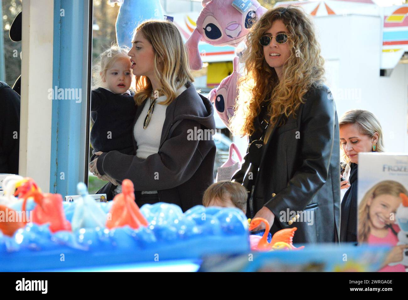 Milan, . 12th Mar, 2024. Claudio Mangiarotti rights copyright Milan - Chiara Ferragni's single life after returning from the United States, she spends the afternoon in the gardens of Parco Sempione with her children Leone and Vittoria, her mother Marina di Guardo. The opportunity to also celebrate the birthday of sister Francesca Ferragni and son Riccardo. Note the sculpted abs of Chiara Ferragni Ph Claudio Mangiarotti Credit: Independent Photo Agency/Alamy Live News Stock Photo