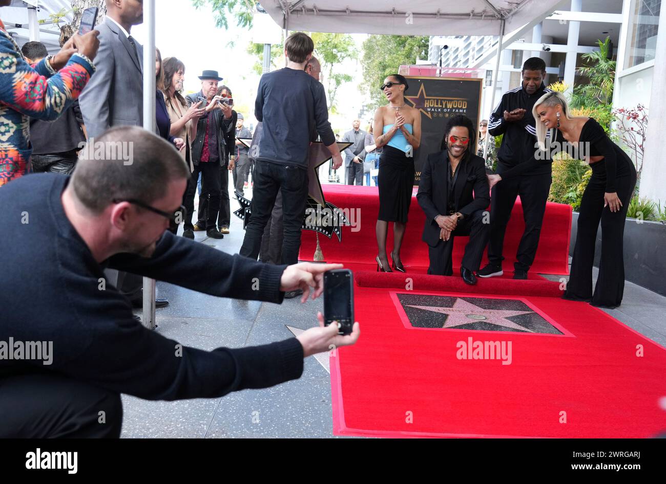 Channing Tatum, far left, takes a picture of Zoe Kravitz, from left