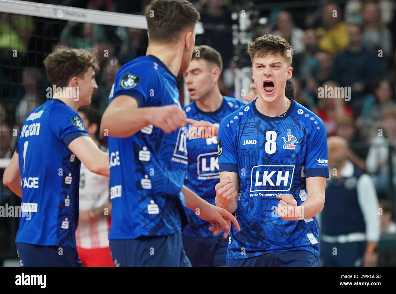 12 March 2024, Lower Saxony, Lüneburg: Volleyball, men: CEV Cup, SVG Lüneburg - Resovia Rzeszow, final, first leg, in the LKH Arena. Lüneburg's Theo Mohwinkel (r) celebrates after winning a point. Photo: Marcus Brandt/dpa Stock Photo