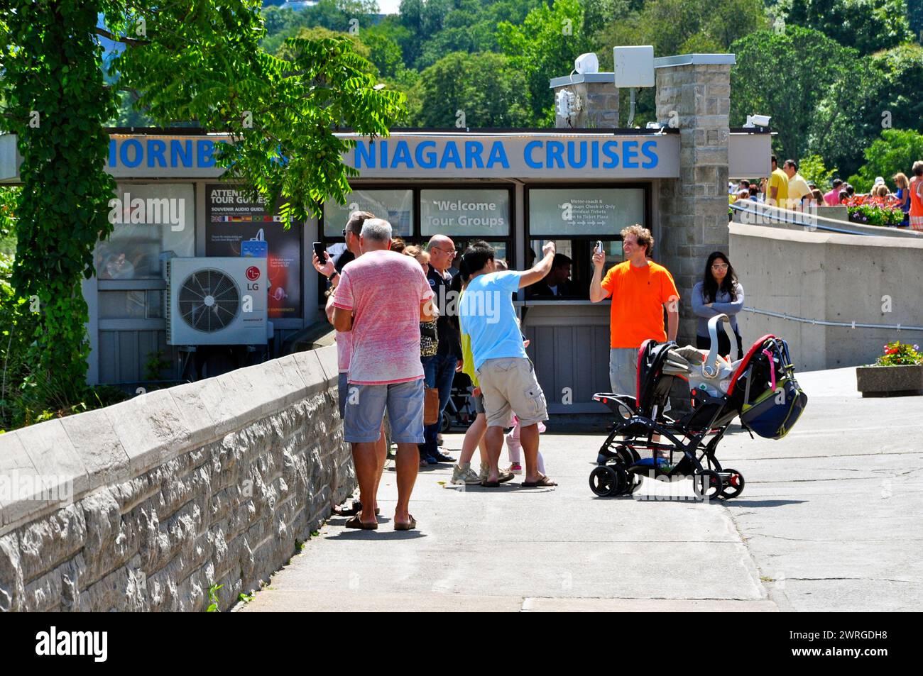 Niagara Falls visitors taking selfies on the Canadian side Stock Photo