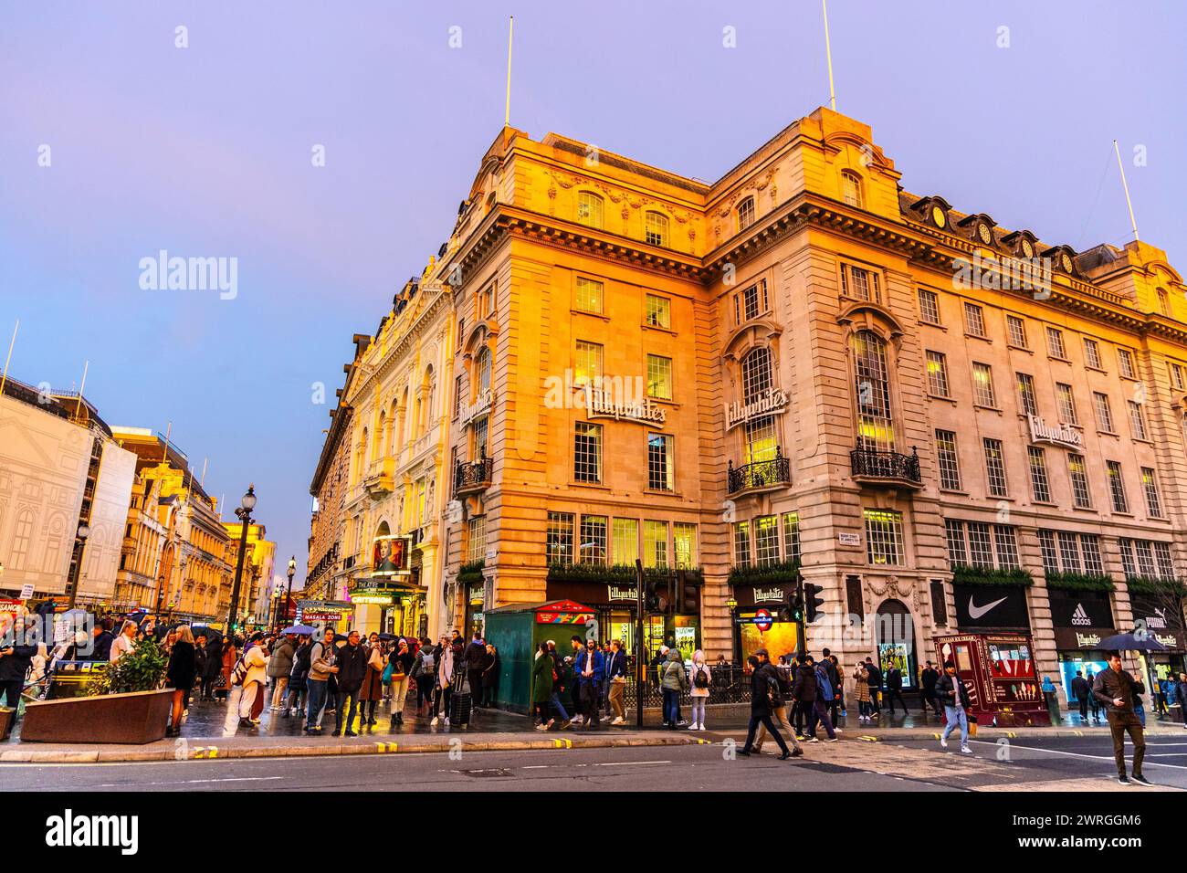 Busy Piccadilly Circus crossing and Lillywhites sports store building, London, England Stock Photo