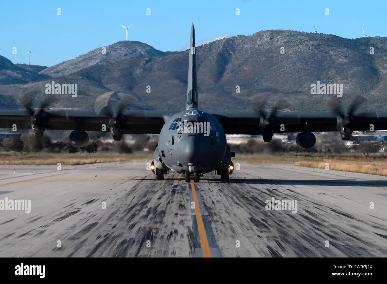 A U.S. Air Force MC-130J Commando II, operated by the 67th Special Operations Squadron, taxis down the flightline during exercise Trojan Footprint 24, Elefsina Air Base, March 8, 2024. Exercise Trojan Footprint promotes peace and security through cooperation, collaboration, and interoperability through a display of solidarity and transparency. (U.S. Air Force photo by Tech. Sgt. Westin Warburton) Stock Photo