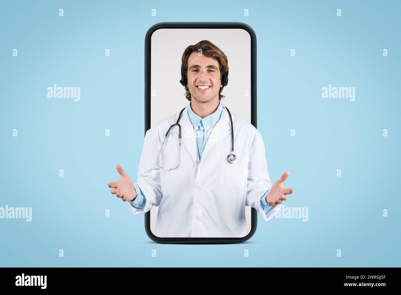 Engaging male doctor in teleconsultation via smartphone app Stock Photo