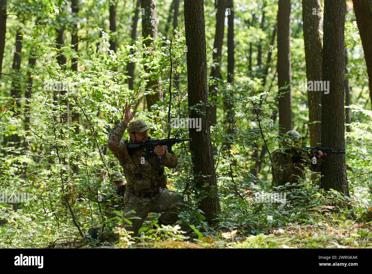 An elite soldier, camouflaged and stealthily navigating through ...