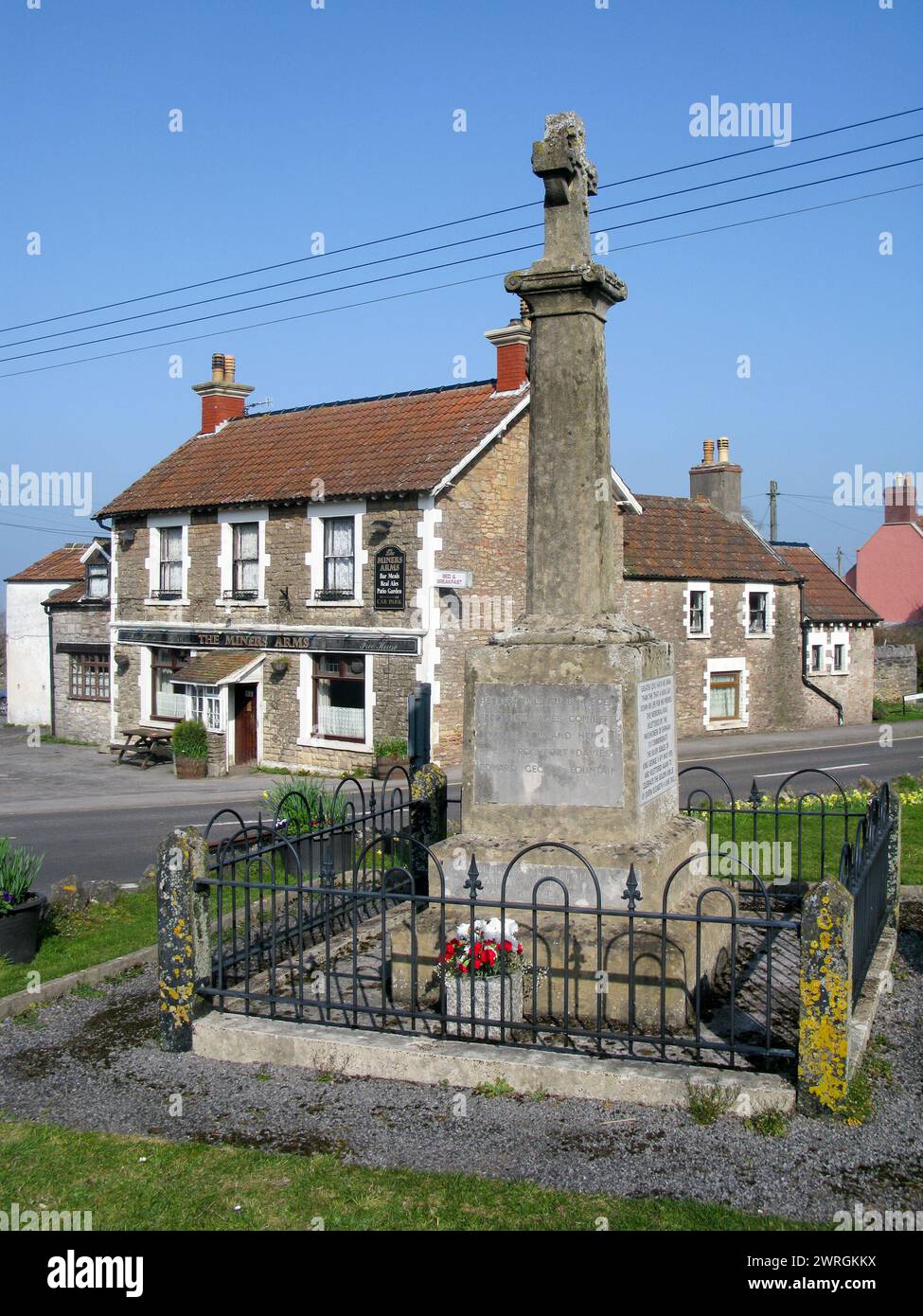 The Miners Arms and war memorial at Shipham, Somerset. The war Memorial was relettered for the silver jubilee of King George v & golden of ER II Stock Photo