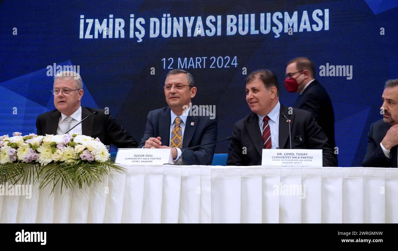 Ozgur Ozel, Chairman of the main opposition party CHP( Republican People's Party) was attended the 'Izmir Business World Meeting' which was organized in cooperation with the Izmir Chamber of Commerce, Aegean Region Chamber of Industry and Izmir Commodity Exchange. Izmir Metropolitan Municipality Mayor Tunc Soyer and CHP Izmir Metropolitan Municipality Mayor Candidate Cemil Tugay also accompanied the meeting that was held days before the local elections. The main topics of Ozgur Ozel's speech were the current economy, inflation and local elections which will held on 31 March 2024. Stock Photo